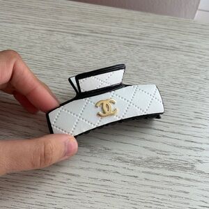Chic White Quilted Hair Clip with Gold Logo